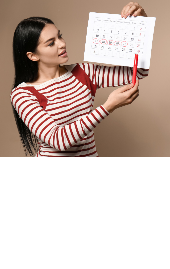 woman holding calendar with days crossed off