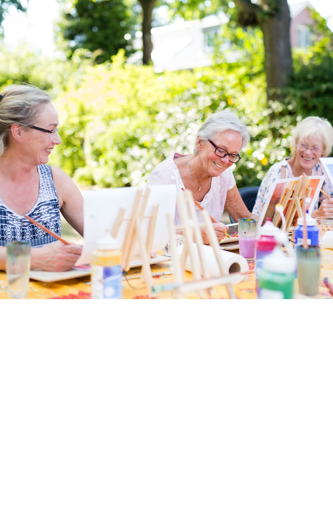 women painting outside 