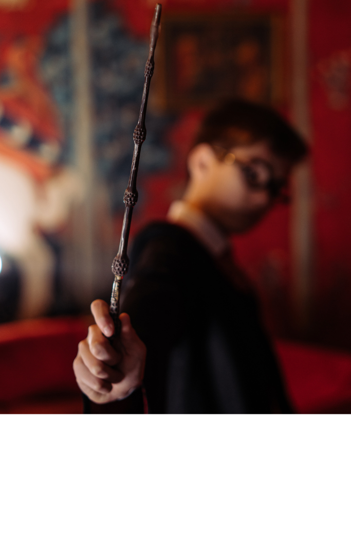 a boy holding a magical wand