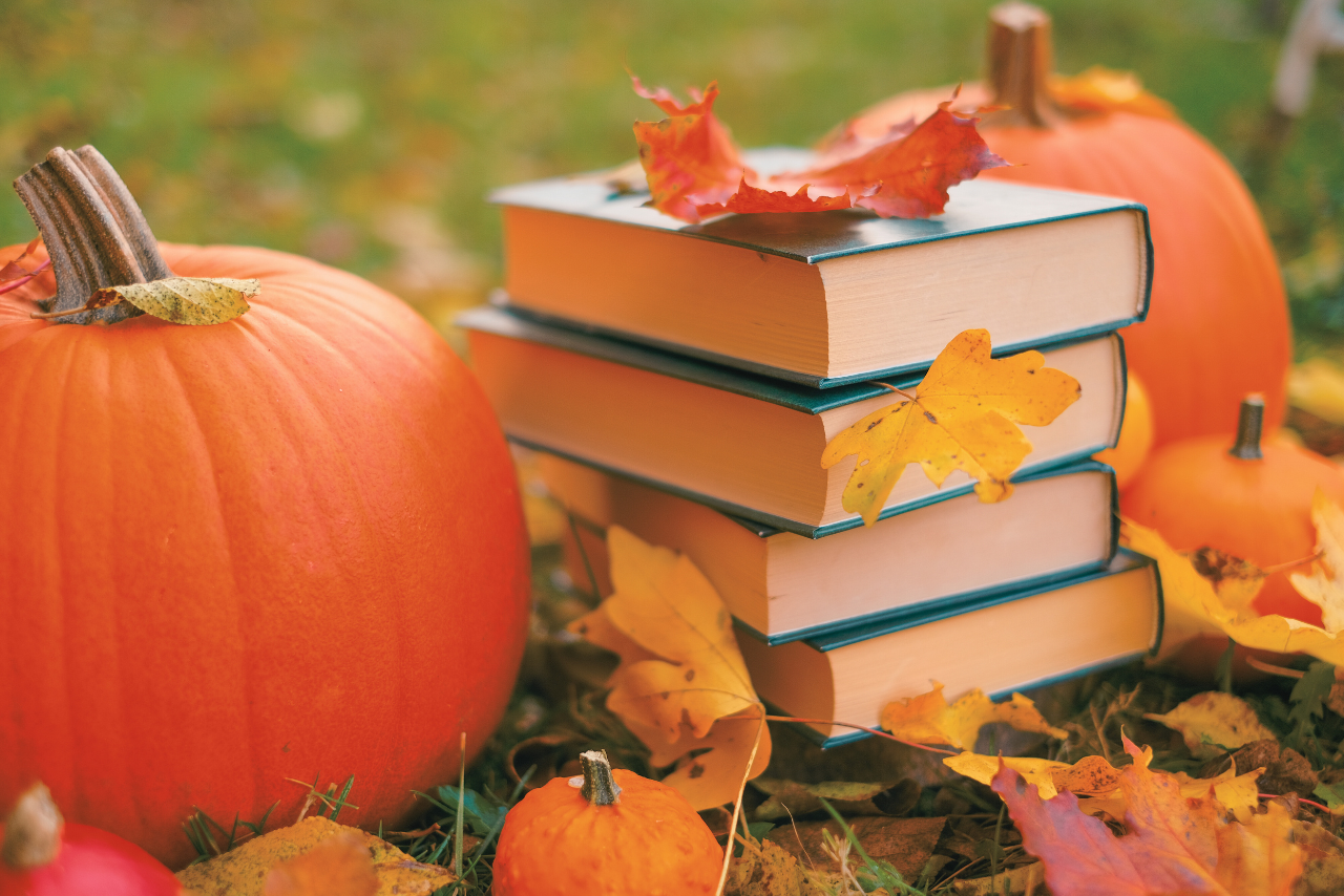 pumpkins and a stack of books 