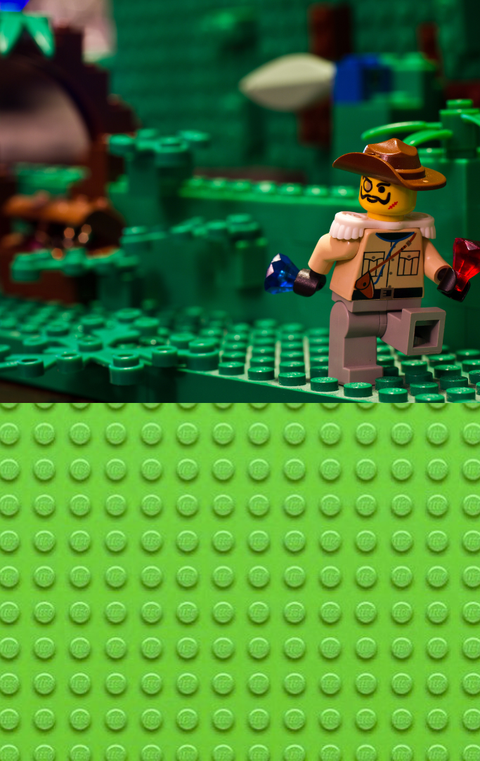 LEGO block scene of a LEGO character on a jungle adventure carrying jewels